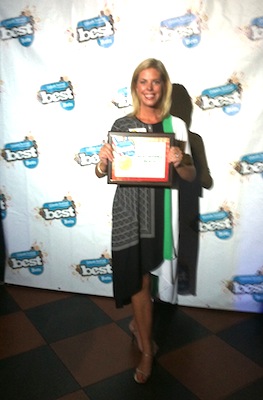 Elizabeth Gifford of SVAA holds plaque for best beach award / Headline Surfer