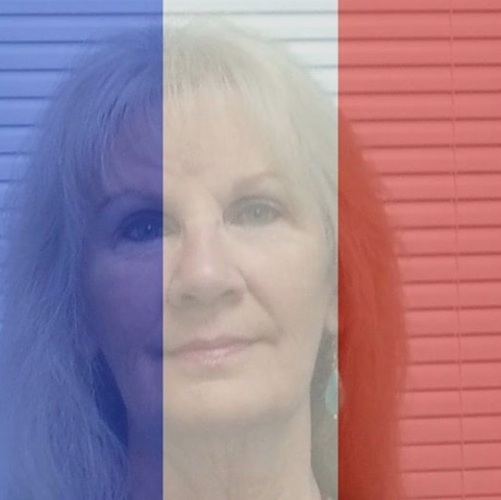 Geraldine Clinton of Oak Hill, Florida, displays French flag with her Facebook photo / Headline Surfer®