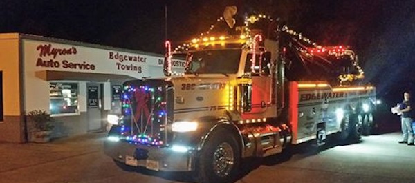 Myron Hammond's large tow truck returns to garage after New Smyrna Beach Christmas Parade / Headline Surfer®