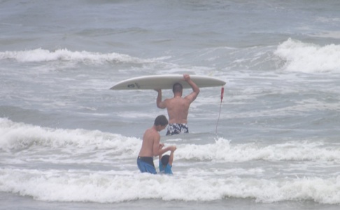 Surfers in New Smyrna Beach, FL enjoy the waves Tuesday / Headline Surfer