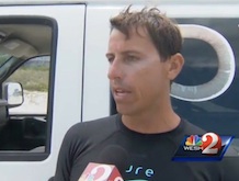 LJ Kuzmovich, who performed CPR on a Georgia boy, 11, struck by lightning in in the surf in Daytona Beach Shores, FL, speaks with reporters /  Headline Surfer®