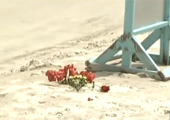 Flowers left at scene of DUI manslaughter on beach / Headline Surfer®