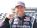 Rallycross driver Rhys Millen gives the No.1 signal after his win at Daytona / Headline Surfer®