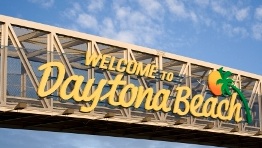 The overhead sign showcasing DaytonaBeach, FL on International Speedway Boulevard / Headline Surfer