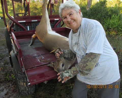 Linda Hyatt of Oak Hill, FL shows off her prized deer catch / Headline Surfer®