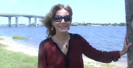 Circuit Judge-elct Karen Foxman interviewed in Daytona Beach with Int'l Speedway Blvd Bridge & Halifax River in background / Headline Surfer®