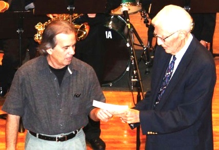 NSB Jazz Festival producer Marc Monteson presents a check in 2011 to George West of Stetson University / Headline Surfer