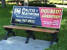 Attorney Michael Politis advertises his law firm with Waverly Media's bus benches / Headline Surfer®