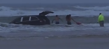 Third child rescued out back of mini van  after SC woman drives into Daytona surf / Headline Surfer®