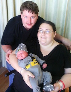 Sally Crank, her husband, Jacob and their newborn. / Headline Surfer®