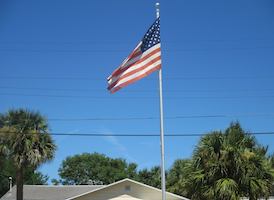 The American flag flies in front of Daytona Beach, FL resident Shirley Dacenzo's home on the 15th anniversary of 9/11 / Headline Surfer