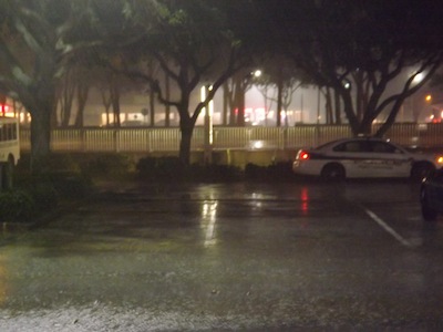 Rain pelts Central Florida, including Port Orangevnear Nova & Spruce Creek shown with cop car / Headline Surfer®