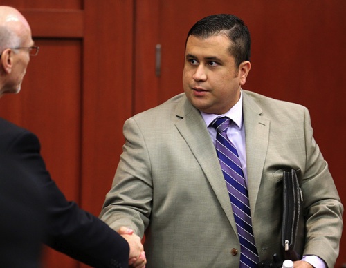 George Zimmerman shakes hands with co-defense counsel Don West / Headline Surfer